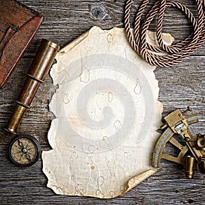 Compass,sextant and spyglass on the timber