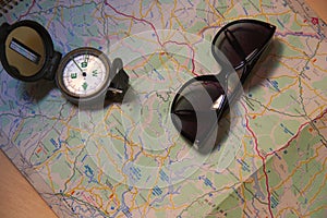 Compass, sunglasses and map all ready for a long trip