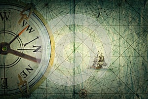 Compass on vintage map. Adventure, stories background.