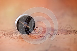 Compass on vintage map. Travel and adventure Concept