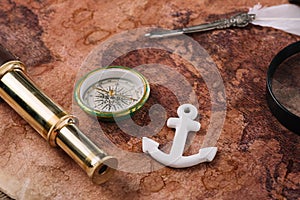 Compass, white anchor, nib and telescope