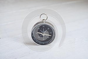 Compass white table background, journey planning concept