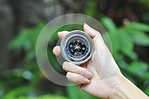 Compass in woman hand