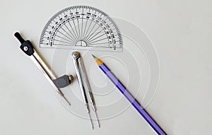 Compasses ,protractor and pencil drawing background