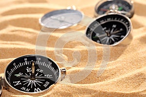 Compasses On Sand