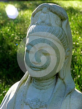 Compassion: smiling Kuan Yin with sunbeam