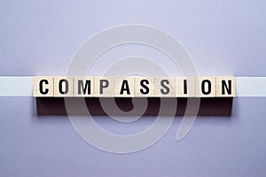 Compassion word concept on cubes