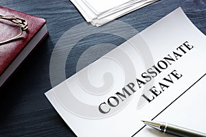 Compassionate leave request form with pen