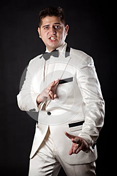 Compere man in an overwhites with a butterfly photo