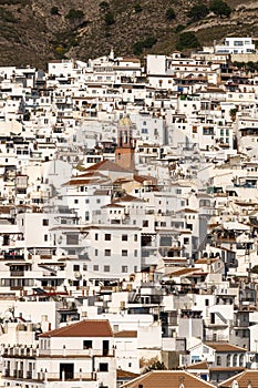 Vertical view of a whitewashed village in the hills above Malaga in the Andalusian backcountry