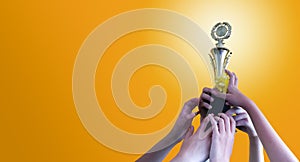 Compete for golden  trophy. Concept photo and  Copy space  Yellow background