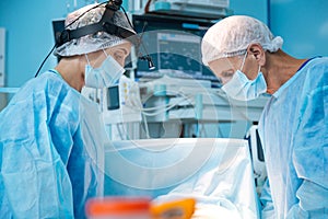 Competent surgeons doing complex operation