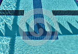 Competition swimming pool with backstroke flag shadows