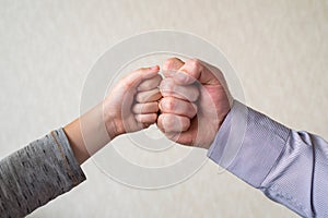 competition and victory, a fist of a child and an adult male close-up. Leader and winner