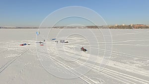 Competitions of paraglider pilots on the frozen lake. Ternopil Ukraine
