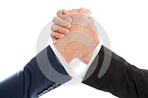 Competitive business people arm wrestling