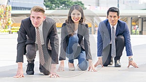 competitive business people in smart suite and cloth sit and prepare to start for running like athletic at outdoor pedestrian