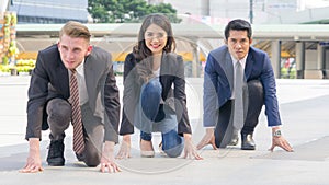 competitive business people in smart suite and cloth sit and prepare to start for running like athletic at outdoor pedestrian