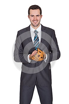 Competitive businessman with baseball glove photo