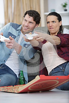 competitive couple playing computer game