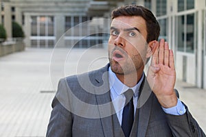 Competitive coworker trying to hear all secrets