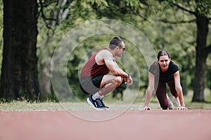 Competitive runners prepare for a race in a lush park, discussing strategies