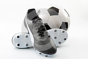 Competitive team sports, active life hobbies and athletic gear concept with old-fashioned black leather football cleats or