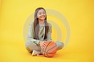 Competitive teen girl playing basketball. teen girl practicing basketball skills. Teen girl excelling in basketball