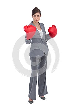 Competitive woman with red boxing gloves