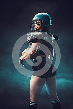 Competitive woman with rugby ball