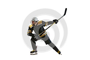 Competitive young man, hockey player in black uniform training, playing isolated on white background