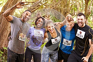 Competitors celebrate completing an endurance sports event