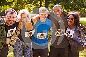 Competitors celebrate completing an extreme endurance event