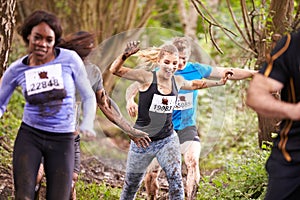 Competitors enjoying a run in a forest at an endurance event