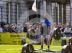 Competitors strain in the power lifting heat of the Ultimate Strongest Man competition.