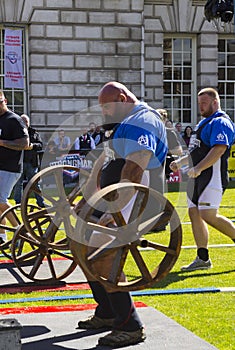 Competitors strain in the power lifting heat of the Ultimate Strongest Man competition