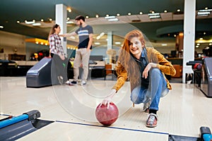 Competitve people enjoying bowling