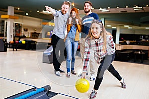Competitve people enjoying bowling