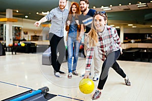 Competitve people enjoying bowling