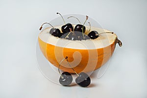 Compisition on white background with fruit. Melon, cherrys