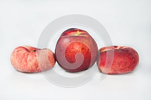 Compisition on white background with fruit. Peaches