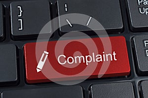 Complaint button keyboard with pen icon.