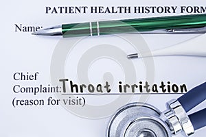 Complaint of Throat irritation. Paper health history form, which is written on the patient`s chief complaint of Throat irritation,