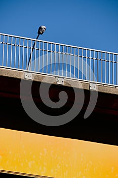 Complementary!  Section of bridge painted yellow against blue sky