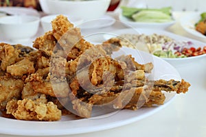 Complementing fish recipe - deep fried fish served with spices, vegetable and special sauce.