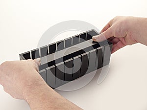 Complete box to cut sushi with a half-moon shape with its squeeze placed inside to tighten photo