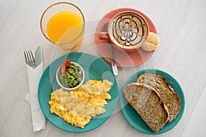 Complete breakfast with coffee, juice and toasts photo