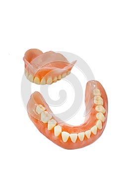 Complete full dentures isolated on white background