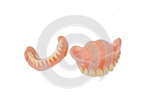 Complete full dentures isolated on white background