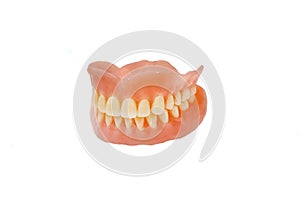 Complete full dentures isolated on white background
